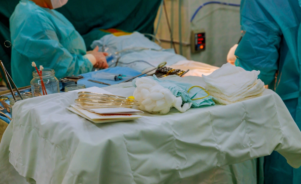 midsection surgeons standing by surgical equipment table