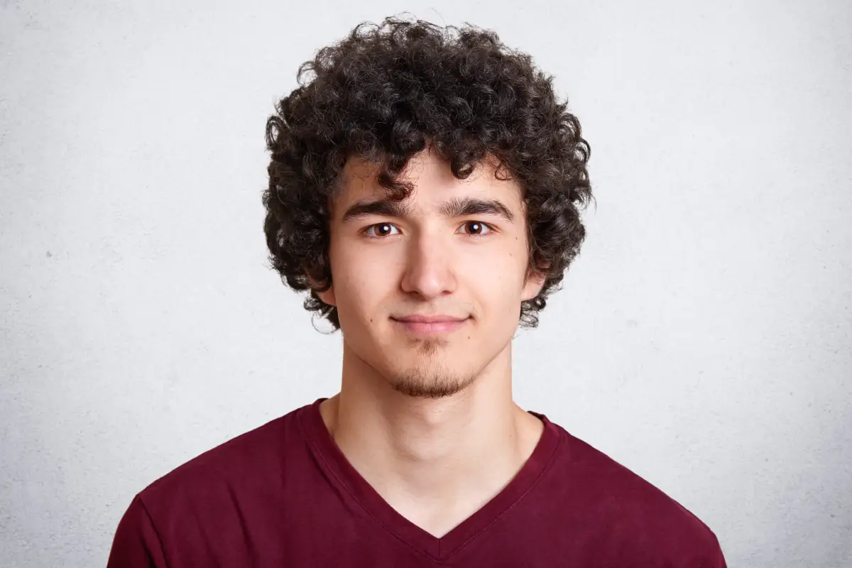 close up portrait curly handsome european male (1)